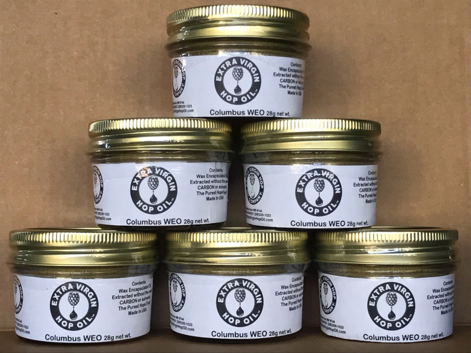 Extra Virgin Hop Oil jars with trademark label